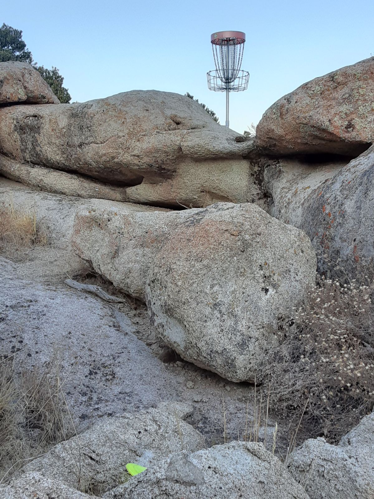 Basket set among granite boulders with desert terrain at Three Peaks